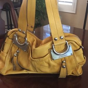 B. Makowsky yellow Handbag